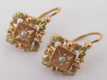 A pair of 18 ct two colour gold