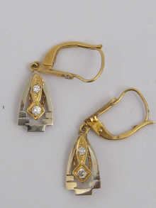 A pair of yellow and white metal