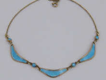A silver gilt and enamel necklace