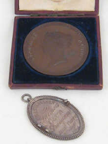 A white metal (tests silver) medal