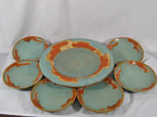 A ceramic fruit dish and six plates
