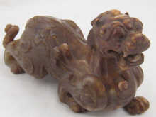 A Chinese carved brown jade kylin