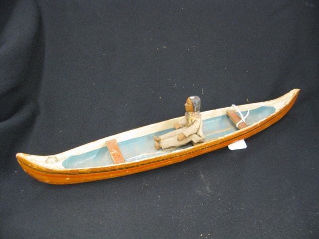 Carved Wooden Canoe with Indian