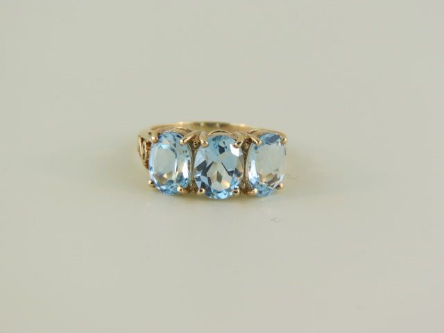 Blue Topaz Ring a trio of vivid gems