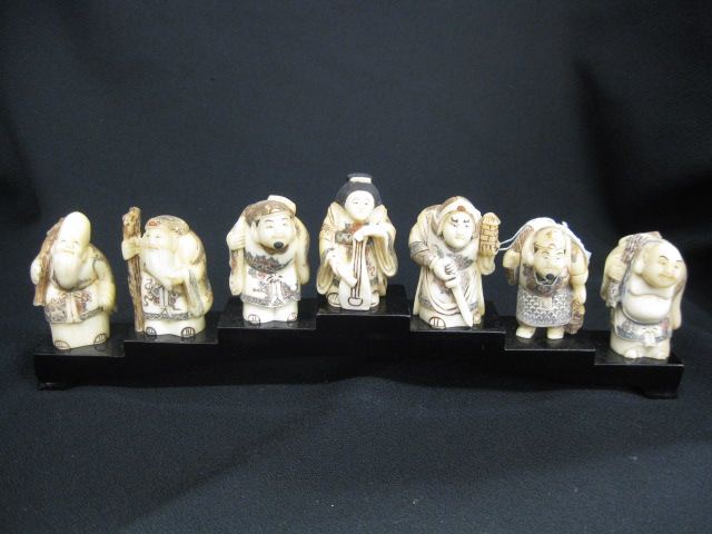 7 pc Set of Carved Figurines of 14c061