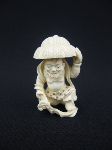 Carved Ivory Netsuke of a Man with 14c067