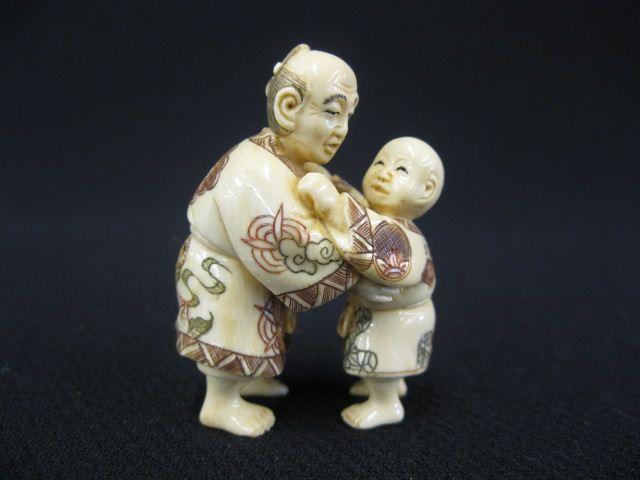 Carved Ivory Netsuke of Man picking