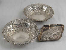 A pair of silver bon bon dishes
