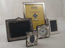 A silver photo frame 24 x 19 cm with