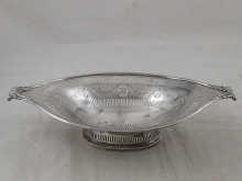 An open two handled silver dish