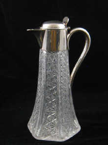 A silver mounted cut glass claret