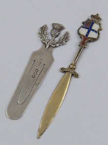 A silver book mark with thistle