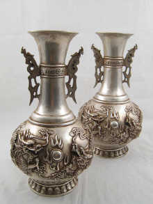 A pair of large cast white metal 149af6