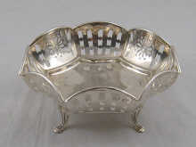 An octagonal silver pierced basket on