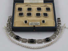 A boxed set of collar studs cufflinks 149b3e