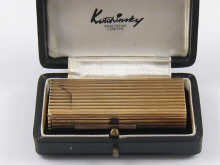 A 9 ct gold petrol lighter by Kutchinsky