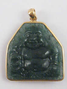 A carved green hardstone figure 149b6a