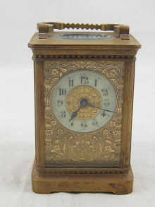 A brass carriage clock with enamel