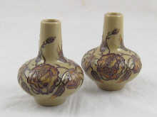 A pair of Moorcroft squat vases
