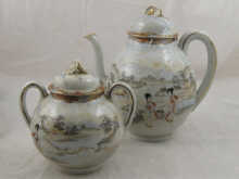 An Oriental teapot and basin both