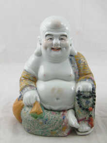 A finely enamelled ceramic figure