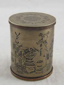 A turned brass lidded opium jar