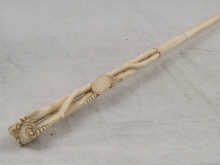 A finely carved ivory riding crop