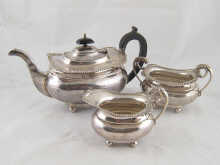 A three piece silver teaset of barge