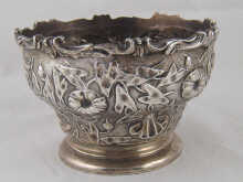 A heavy silver bowl with applied 149c29