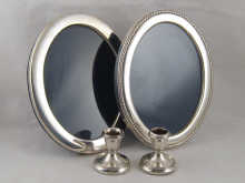 Two modern silver oval photo frames