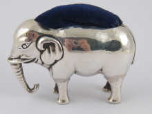 A silver elephant pin cushion replaced