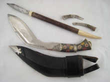 A Nepalese kukri in leather cased hardwood