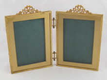 A gilt metal double photo frame