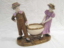 A Royal Worcester group of a boy