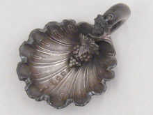 A silver caddy spoon of shell and grape