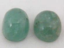 Two loose polished cabochon emeralds 149d97