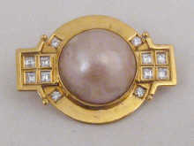 An 18 carat gold diamond and pearl brooch