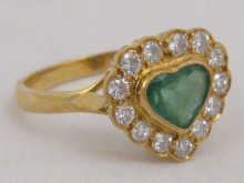 An 18 carat gold diamond and emerald 149dab