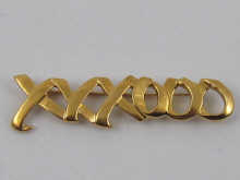 An 18 carat gold brooch designed