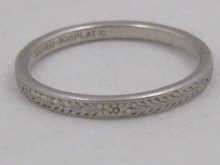 A platinum band ring.