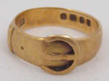 An 18 carat gold buckle ring hallmarked 149dc8