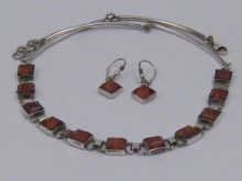 An amber necklace set in white