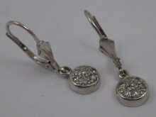 A pair of white metal (tests 18