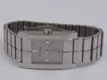 A stainless steel tank style watch with