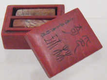 A red Chinese hardstone box with 149e56