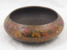 A hand decorated brass bowl from