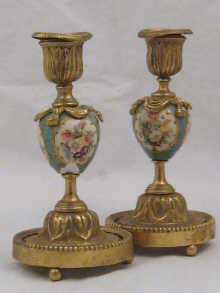 A pair of gilt metal candlesticks