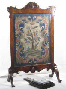 A walnut veneered tapestry fire