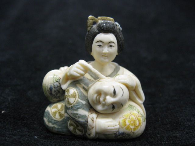 Carved Ivory Netsuke of Ladycleaning