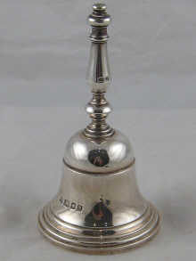 A silver table bell by Richard Comyns